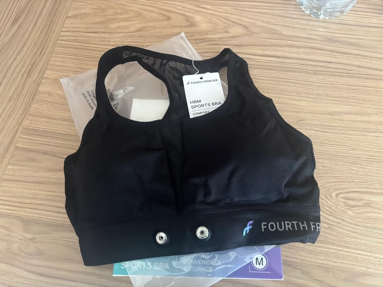 The Fourth Frontier HRM Sports Bra with its two sensor attachment snaps visible on the lower band.