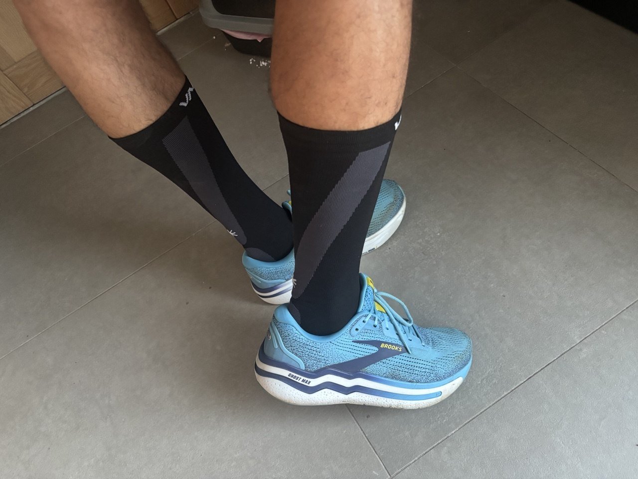 Jos wearing black VALSOLE Compression Max socks with Brooks running shoes.